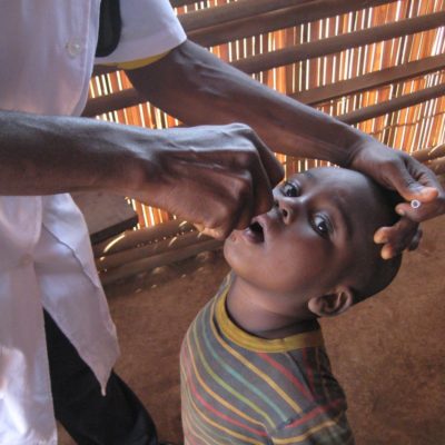 Boy being given medicine