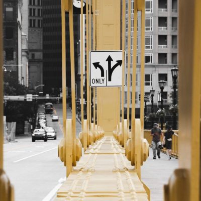 Bridge with a road sign depicting lanes