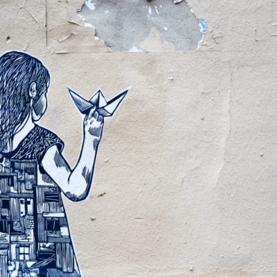 cartoon girl with origami on wall